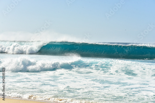 wave breaking on the beach Banzai Pipeline Hawaii