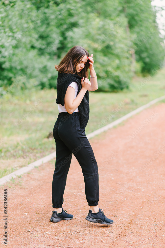 Stylish hipster girl in white t-shirt outdoors posing Stylish hipster girl in white t-shirt outdoors posing