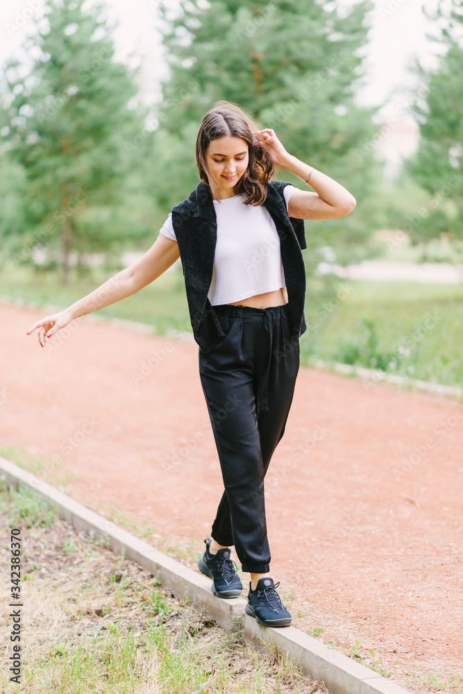 Stylish hipster girl in white t-shirt outdoors posing Stylish hipster girl in white t-shirt outdoors posing