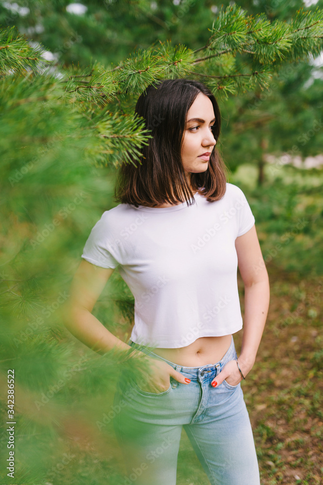 Stylish hipster girl in white t-shirt outdoors posing Stylish hipster girl in white t-shirt outdoors posing