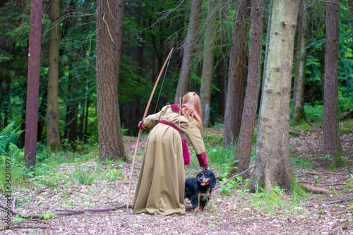 archery woman with dog © Mandy