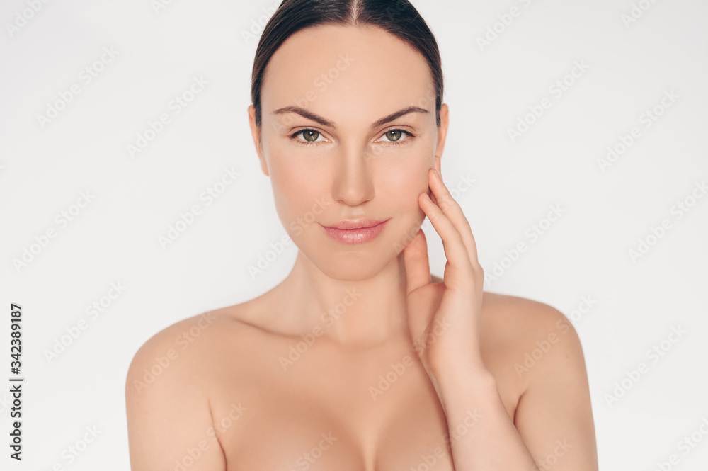 Close up portrait of beautiful half naked natural beauty woman with perfect skin and hair isolated white background. Cleaning healthcare treatment. Skincare spa concept. Space for text mockup Close up portrait of beautiful half naked natural beauty woman with perfect skin and hair isolated white background. Cleaning healthcare treatment. Skincare spa concept. Space for text mockup