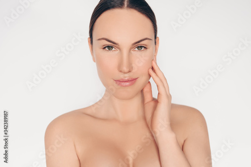 Close up portrait of beautiful half naked natural beauty woman with perfect skin and hair isolated white background. Cleaning healthcare treatment. Skincare spa concept. Space for text mockup