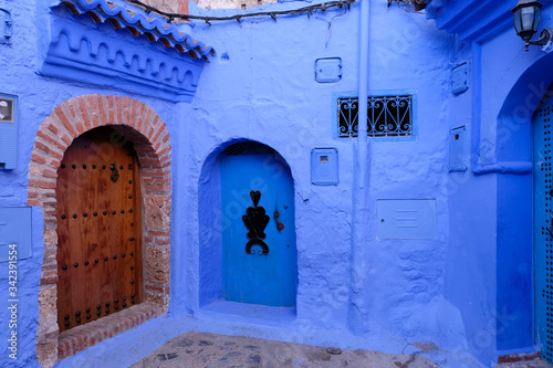 Blue house facade in Chefchaouen town, Morocco. © leospek