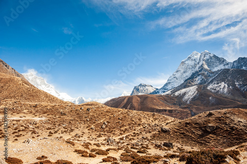 Valley leading to the Everest base camp with Cholatse and Taboche peak. Trekking in Nepal Himalayas. EBC (Everest base camp trek) trail upper part from Lukla to EBC of Everest trek. Nepal.