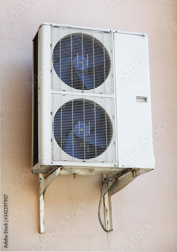 Air conditioning outside the building. Air ventilation system in the house. Climatic equipment. Installation and maintenance of air conditioners. Creating a favorable microclimate in the room.