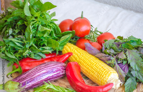 Raw vegetables close up. Top view of fresh tomatoes  basil  eggplant  red pepper and corn. Healthy eating concept  vegetable background. Selective focus image  flat lay. Copy space.