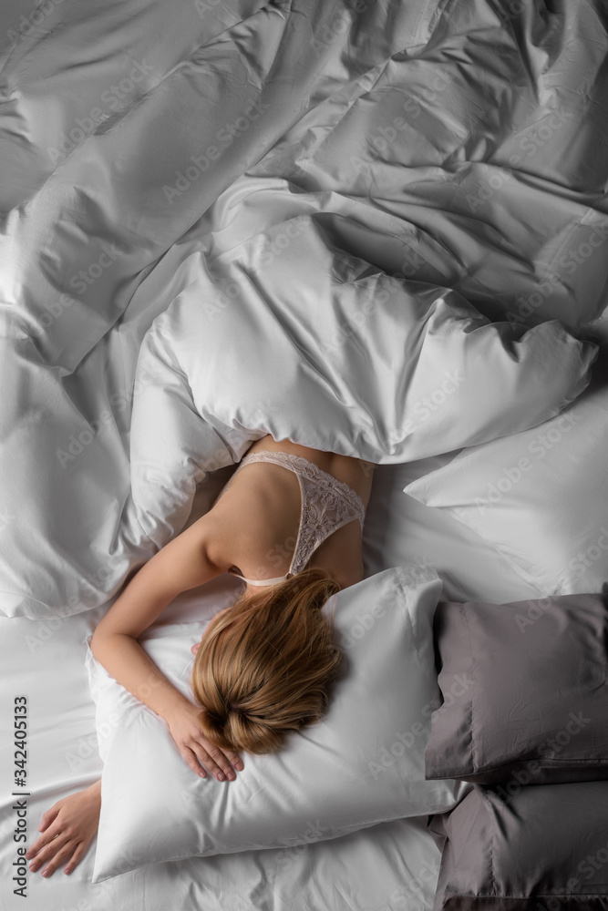 nude young woman sleeping in bed in beautiful white bedding Stock Photo ...