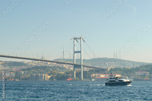 15 July Martyrs Bridge, Bosphorus bridge. famous bridge over  Bosphorus Strait on sunny day against blue sky. popular tourist destination. Selective focus. Turkey, Istanbu © Elena