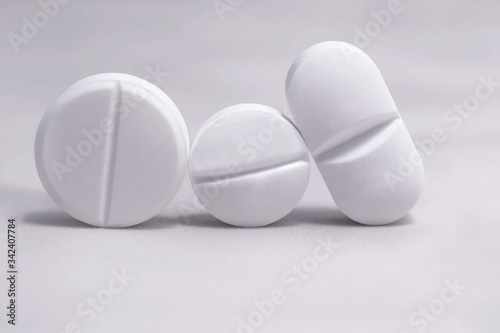 Macro of white pills on isolated background. Pharmacy drug. Medicine