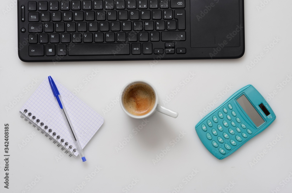 Office : PC keyboard, notebook, calculator and coffee cup Office : PC keyboard, notebook, calculator and coffee cup