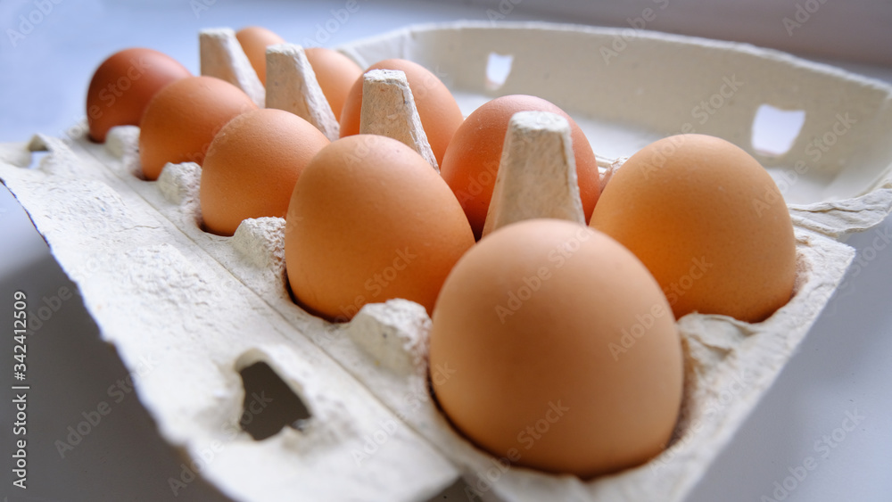 chicken eggs in a roar lie on the table chicken eggs in a roar lie on the table