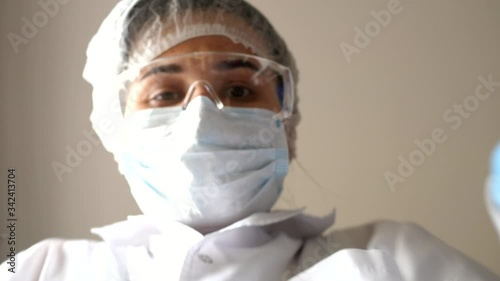 doctor reaches inside the box with the delivery of medical equipment