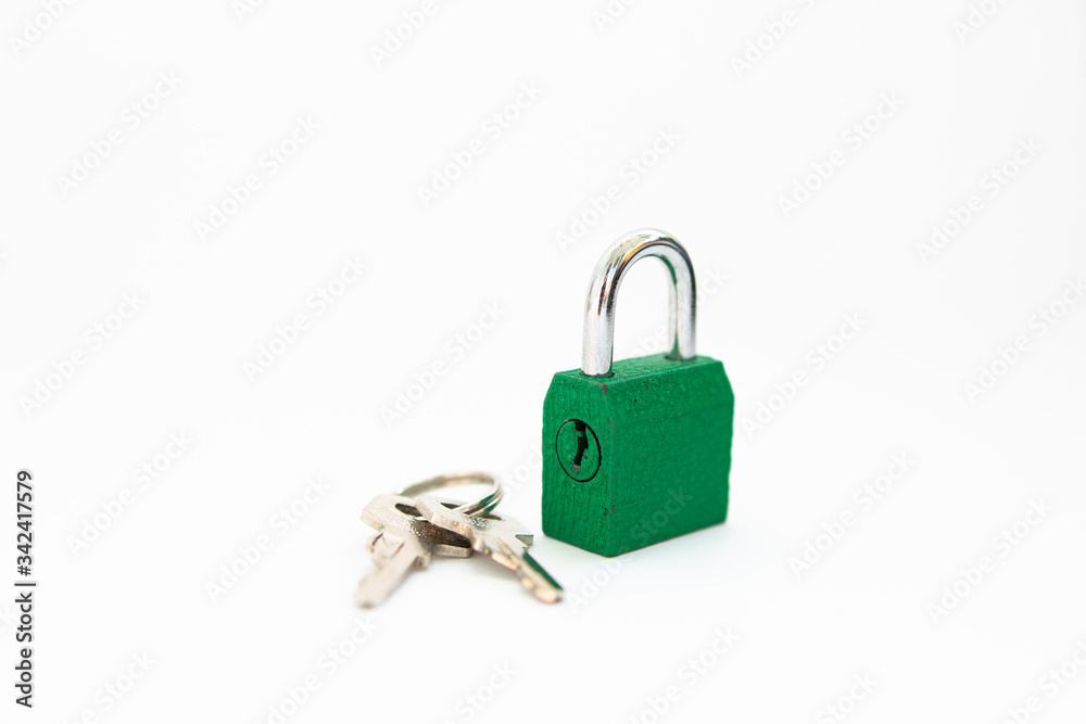 small lock with a key on a white background small lock with a key on a white background