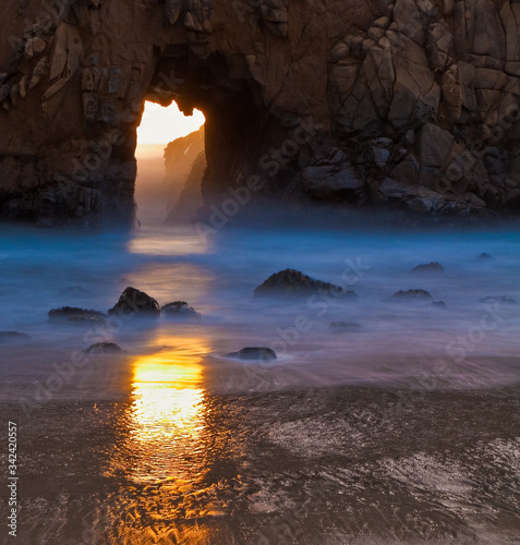 Sunset Through Portal in Pfeiffer Beach Arch at Pfeiffer Beach Pfeiffer Big Sur State Park  Big Sur  California  USA