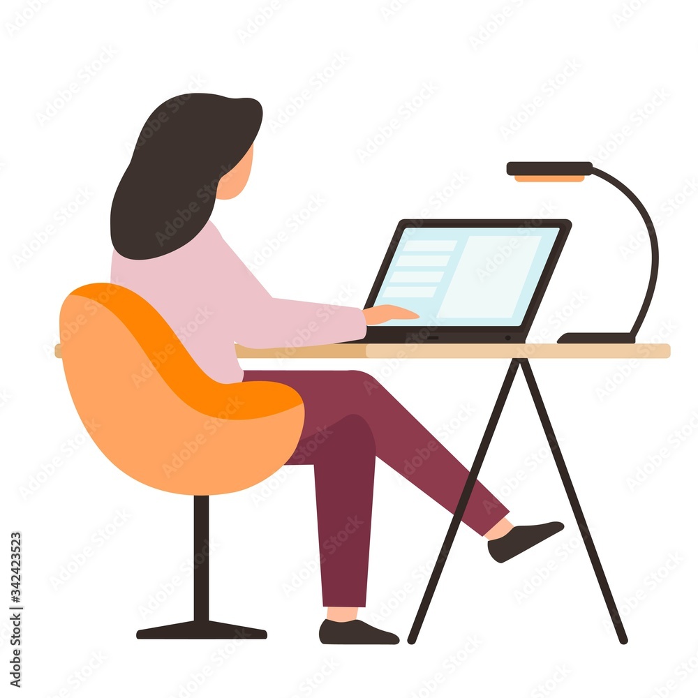 The girl looks at the laptop screen. A young woman works at a computer. The girl looks at the laptop screen. A young woman works at a computer.