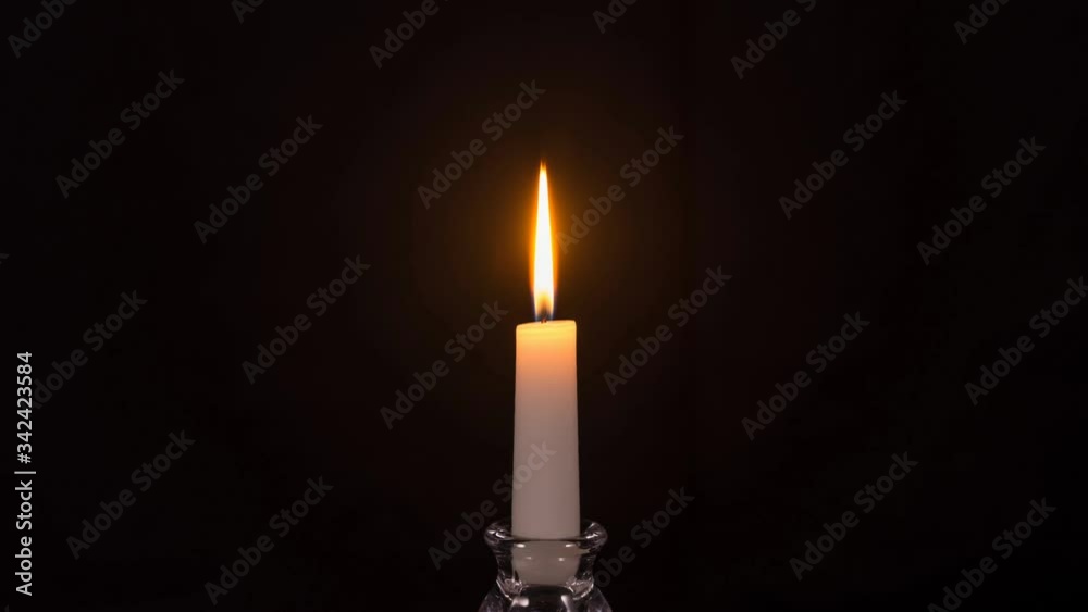 Time-lapse of a white candle burning out
