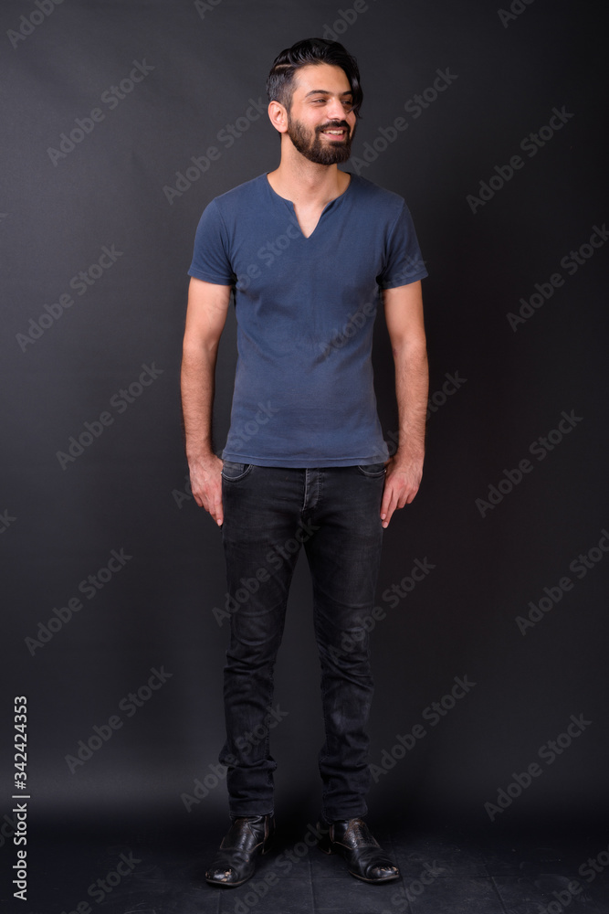Full body shot of handsome bearded Persian man Full body shot of handsome bearded Persian man