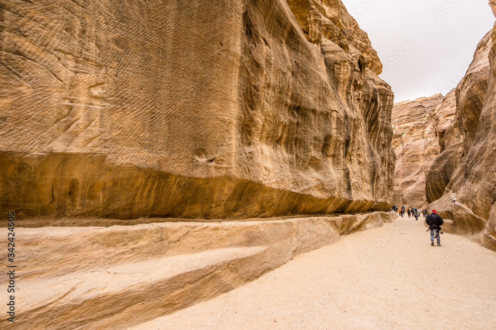 pedestrians in a canyon at Petra, Jordan