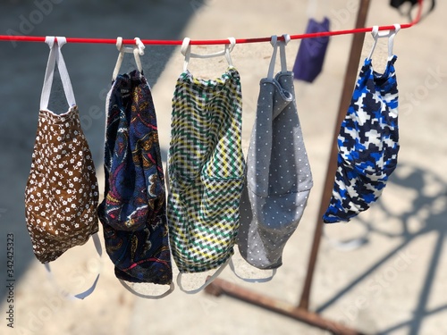 Cotton cloth mask hanging outdoor after the used and washing,natural glare light,the mask repeated use 2-3 times,after use every day should wash and dry in the sun to be sterilized as well,coronavirus