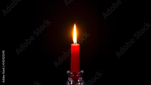 Time-lapse of a red candle burning out
