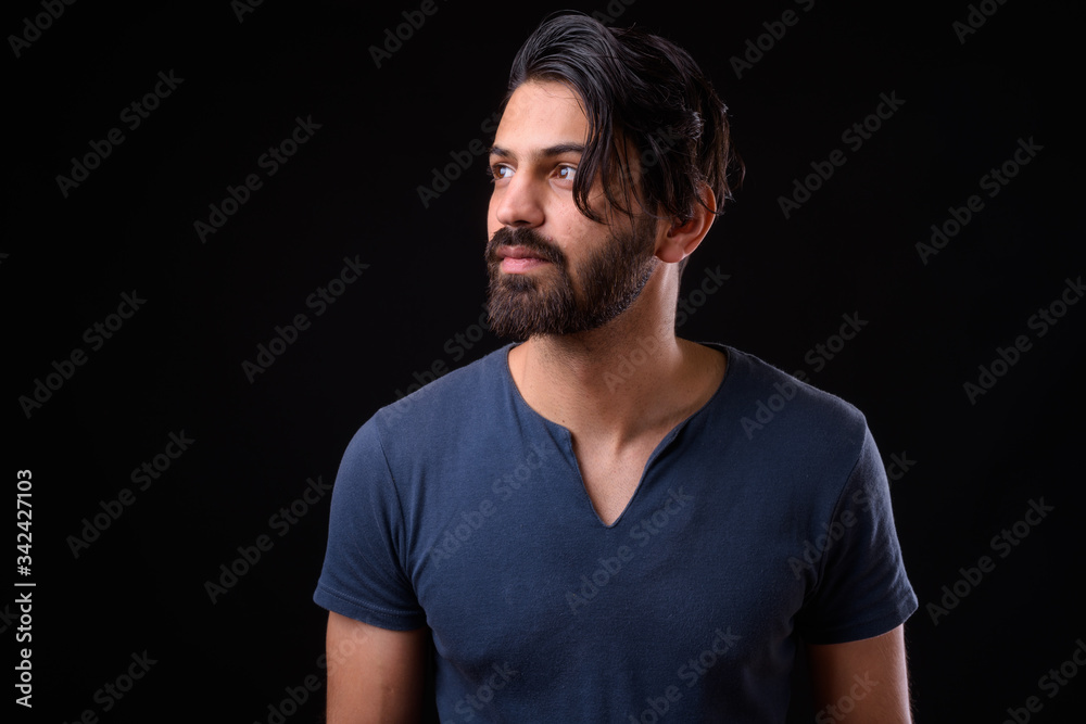 Face of handsome bearded Persian man thinking Face of handsome bearded Persian man thinking