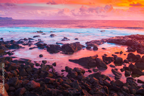 Sunrise on Lava Rock Shore at Ahukini Landing, Lihue, Kauai,Hawaii, USA photo