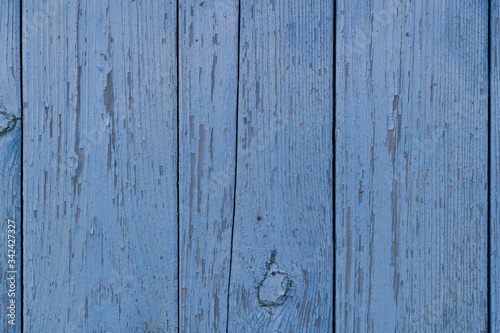 old wooden wall texture with peeling blue paint