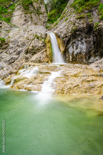 Beautiful scenery of Stuibenfälle - River and waterfall at Reutte in mountain scenery of Alps, Austria photo