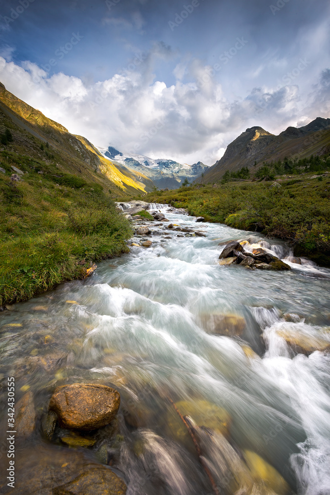 landscape with a river high in the mountains, swiss alps