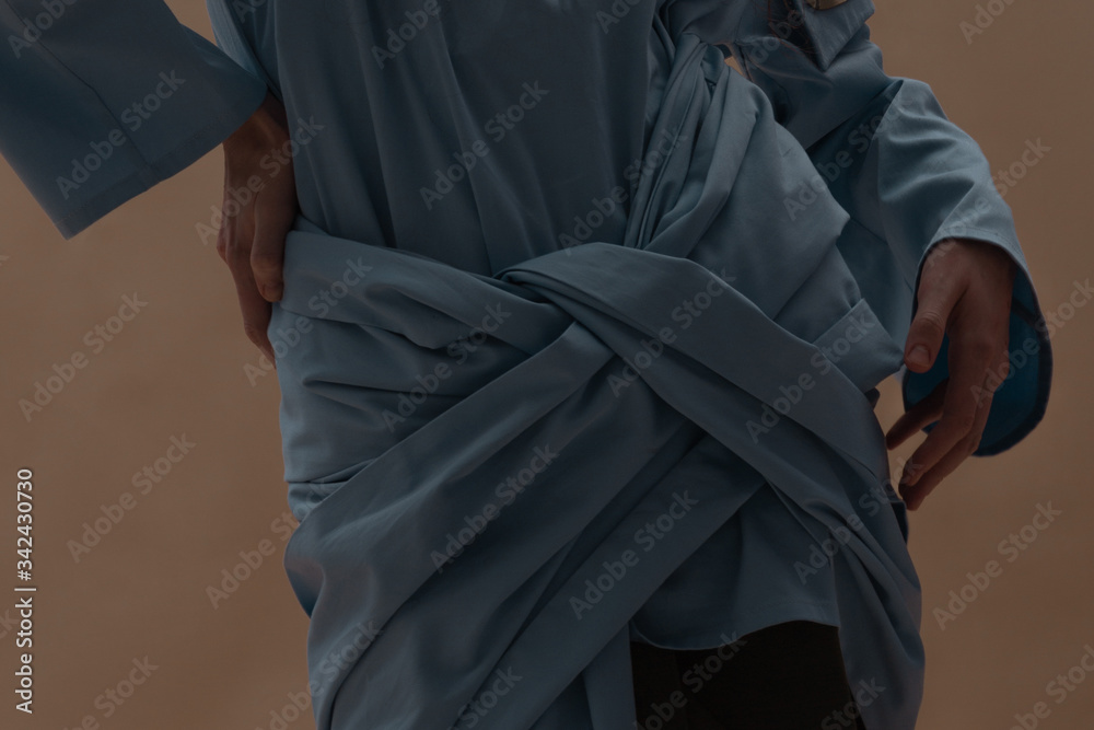 Close-up shot of beautiful blue cotton blouse on a female model