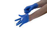 Doctor putting on blue gloves glove holding a gel alcohol in both hands - studio on white background 