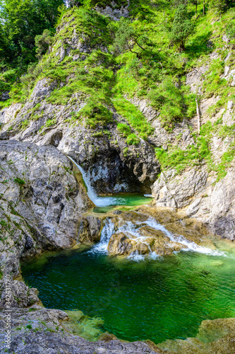 Beautiful scenery of Stuibenfälle - River and waterfall at Reutte in mountain scenery of Alps, Austria photo