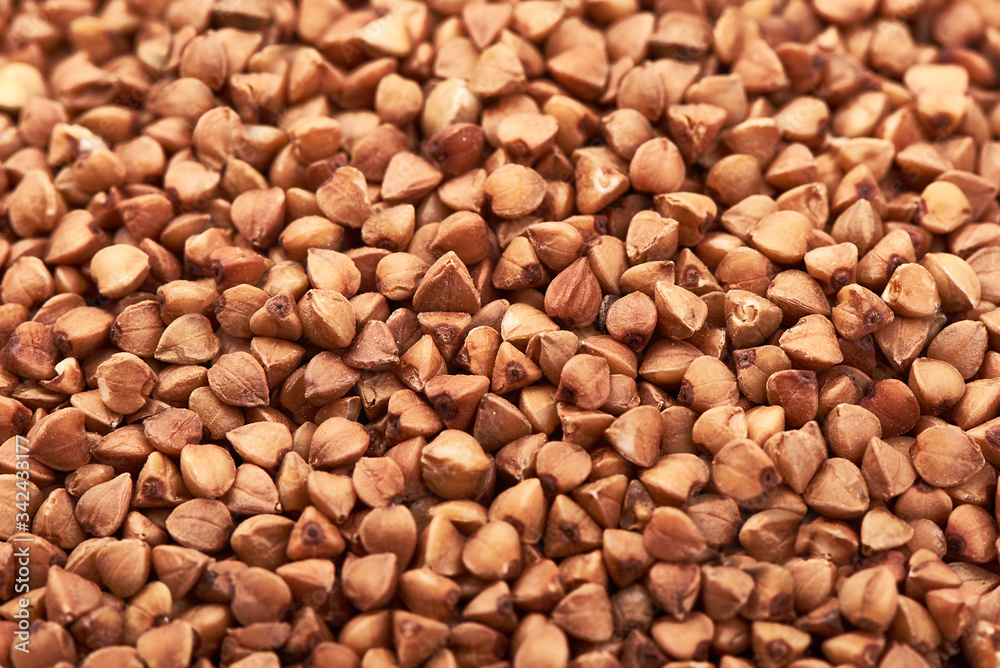 Buckwheat background, close-up of raw porridge Buckwheat background, close-up of raw porridge