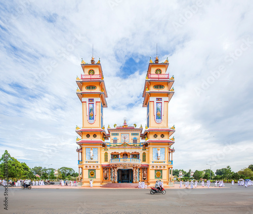 Cao Dai temple area and meditating followers of the Cao Dai religion in the temple Cao Dai  Tay Ninh  Vietnam