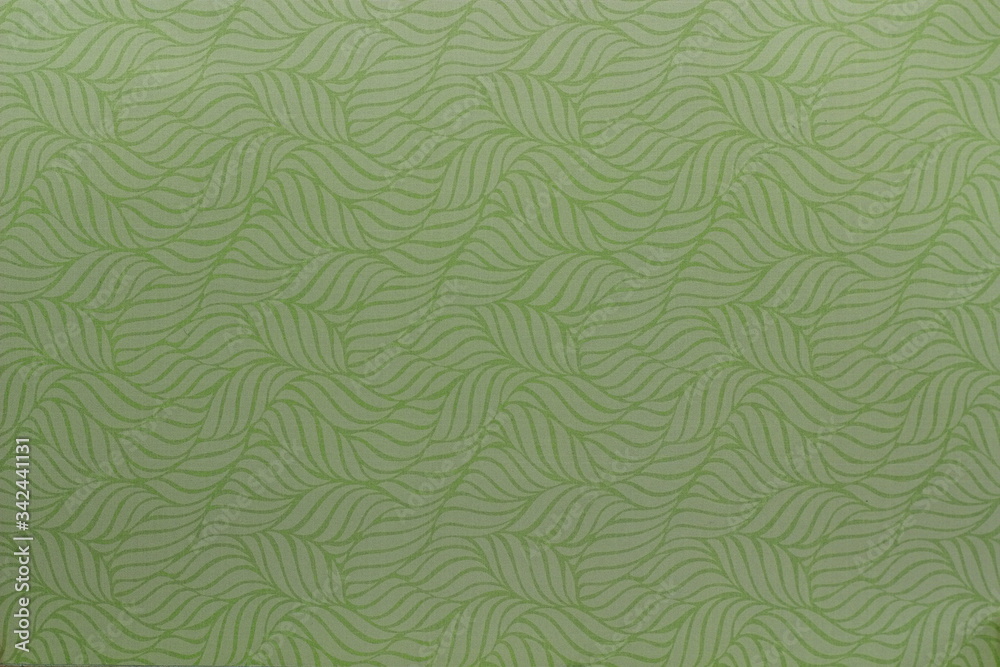 A close up color image of twisted leaves design on paper that is used for crafting and card making.