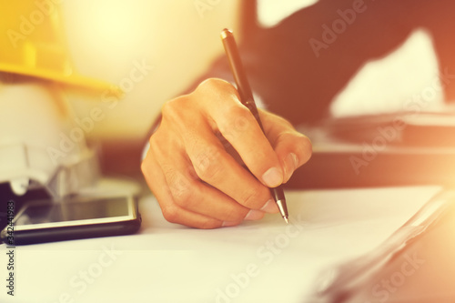 Close up Hand writing on document or signature to contract business