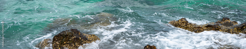 Fototapeta premium Beautiful nature view of sea beach on blurred blue with copy space using as background natural landscape, fresh cover page, world oceans day concept.