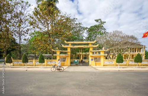 Cao Dai temple area and meditating followers of the Cao Dai religion in the temple Cao Dai, Tay Ninh, Vietnam