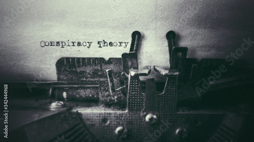 Conspiracy Theory text typed on paper with old typewriter in vintage background photo