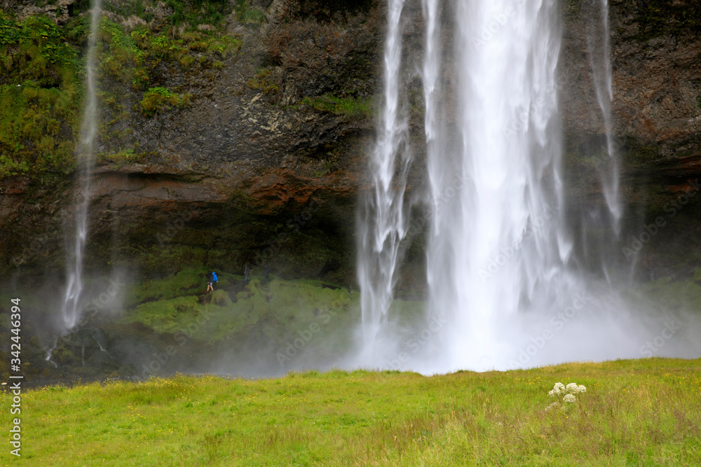 Seljalandsfoss / Iceland - August 15, 2017: Seljalandsfoss one of the most famous Icelandic waterfall, Iceland, Europe Seljalandsfoss / Iceland - August 15, 2017: Seljalandsfoss one of the most famous Icelandic waterfall, Iceland, Europe