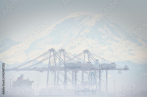 2020-04-23 LARGE SHIP CONTAINER LOADERS IN THE FOG WITH MOUNT RAINIER IN THE BACKGROUND