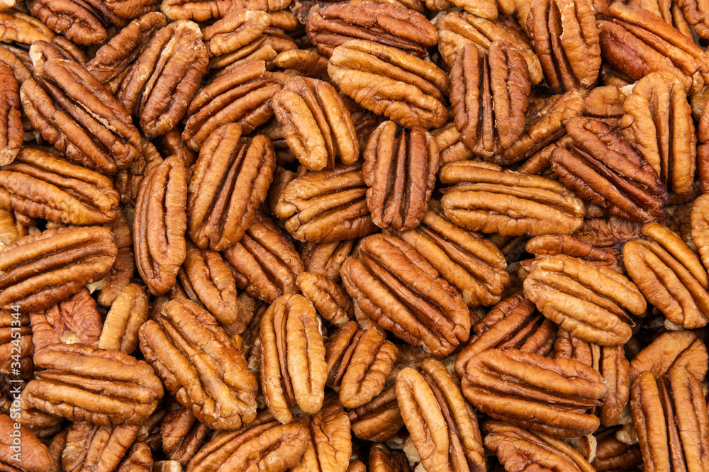 Fototapeta premium Pecan nuts close view as a background