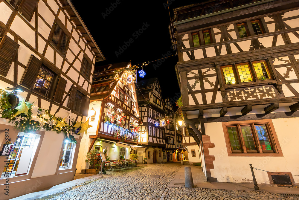 Traditional half-timbered houses in La Petite France at night, Strasbourg, Alsace, France Traditional half-timbered houses in La Petite France at night, Strasbourg, Alsace, France