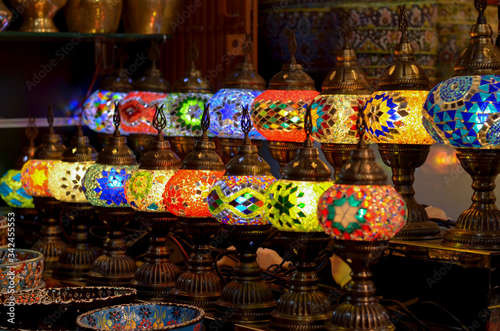Traditional Turkish Lamps, Ottoman Lights, Mosaic Chandeliers on display in a handicraft pawn shop in Istanbul, Turkey during Ramadan month. These are very popular decorative gift item among tourists