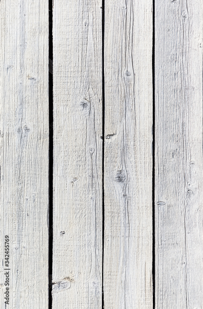 Backgroud of aged natural light old wood fence texture. Vertical orientation. Top view Backgroud of aged natural light old wood fence texture. Vertical orientation. Top view