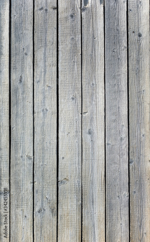 Backgroud of aged natural light old wood fence texture. Vertical orientation. Top view