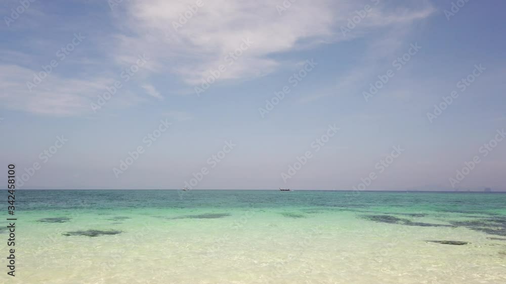 View of the azure sea and in the distance you can see an uninhabited island View of the azure sea and in the distance you can see an uninhabited island