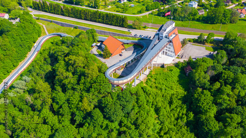 фотографія Beautiful panoramic aerial view photo from flying drone on Sigulda Bobsleigh and Luge Track in summer