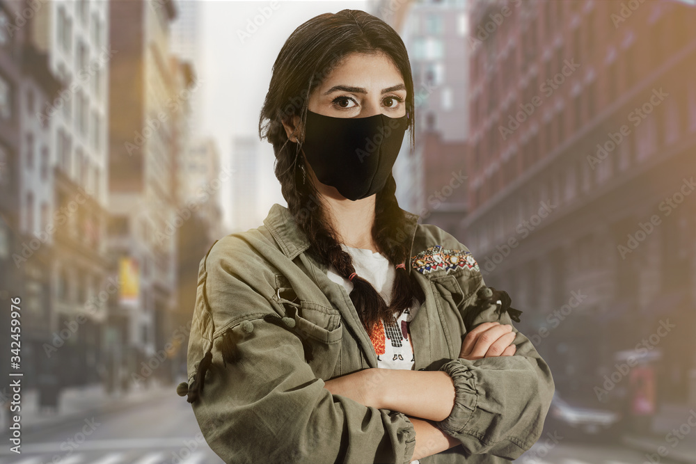 Pretty young European woman on the street with a medical face mask on. Bored student waiting for schools to open. Pretty young European woman on the street with a medical face mask on. Bored student waiting for schools to open.